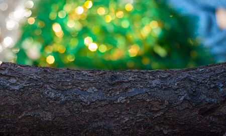 wood beam and blurred green background with bright bokeh, empty space