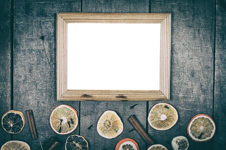 empty picture frame on a wooden surface, vintage toning