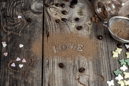 word love written on the gray wooden surface, top viewの写真素材