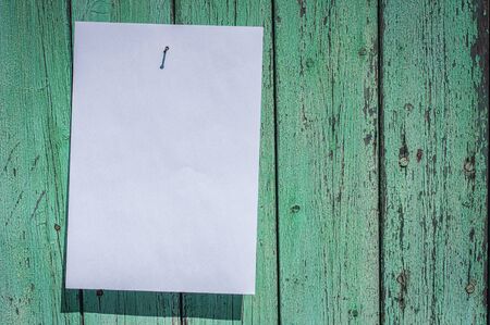 blank white sheet hanging on a wall, empty space on the rightの写真素材