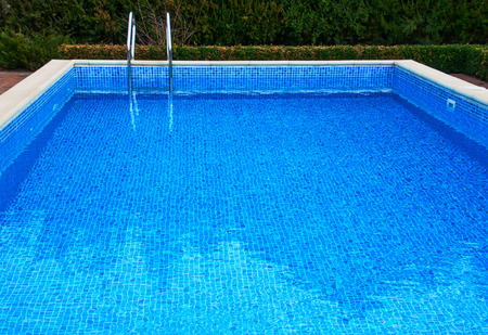 Pool with water, view of the iron staircase for descent and ascentのeditorial素材