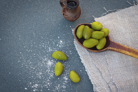 Olive oil and green olives, top viewの写真素材
