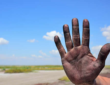right man's hand on a background of a landscape, close upの写真素材