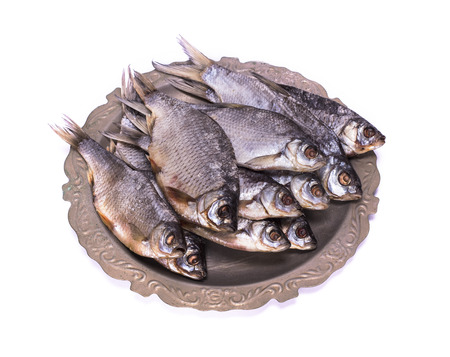 raw fish ram on an iron plate, white background