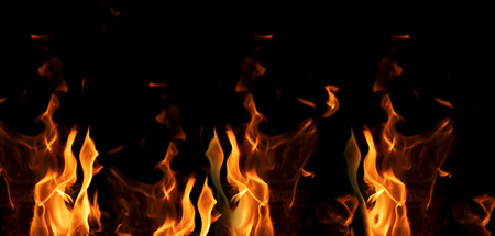 bright orange and yellow flames on a black background,close up, banner