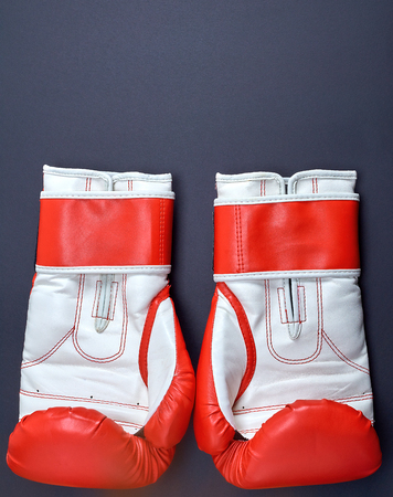 pair of red-white leather boxing gloves on a black background, copy spaceの写真素材