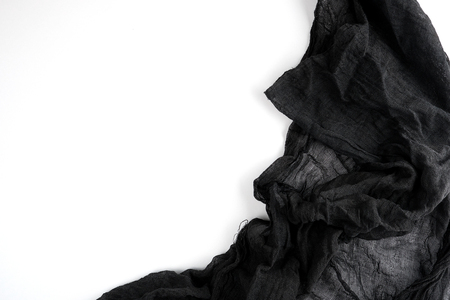 Black textile gauze on a white background, copy spaceの写真素材