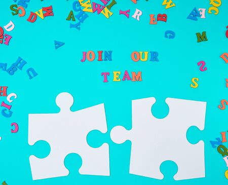 paper blank white puzzle on a blue background,  inscription join our team, concept of recruitment....