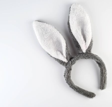 Fur headdress of a hare with ears on a white background, a festive attribute of fancy dressの写真素材