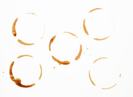 lot of round imprint from a coffee cup on a white paper background, close up