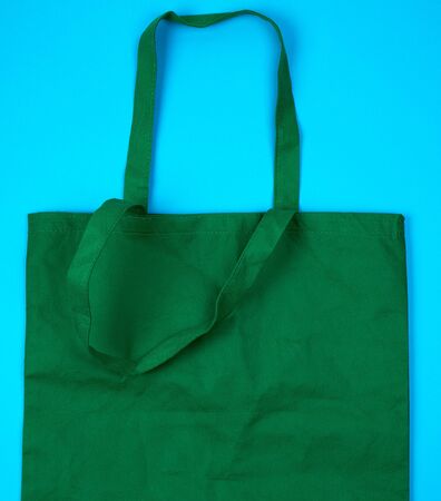 empty green ecological bag made of viscose with long handles, concept of eliminating the use of plastic bags and replacing with ecoの写真素材