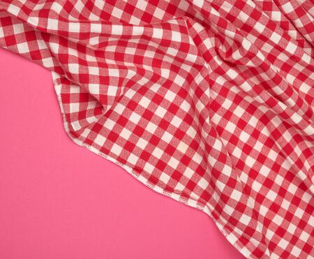 white red checkered kitchen towel on a pink background, bright picnic background, copy spaceの写真素材