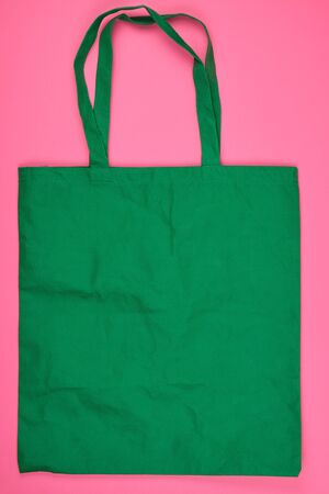 empty green ecological bag made of viscose with long handles, concept of eliminating the use of plastic bags and replacing with ecoの写真素材