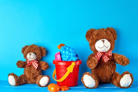 two brown teddy bears on a blue background, friendship concept, copy spaceの写真素材