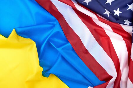 textile flags of Ukraine and the United States of America, symbol of friendship and cooperationの写真素材