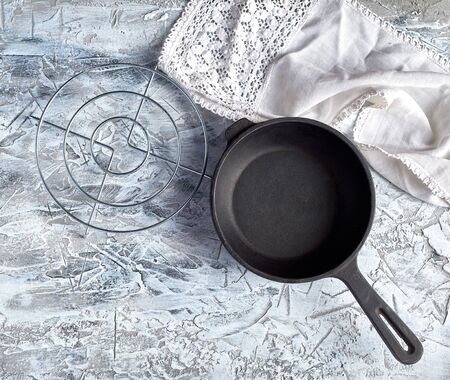 new empty frying pan with a handle on a white background, top viewの写真素材