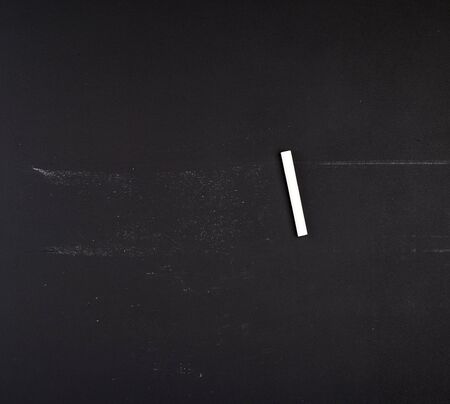 empty black chalk board and white chalk, full frame, copy spaceの写真素材