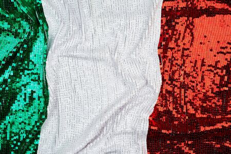 flag of Italy embroidered with shiny square sequins, full frame, close upの写真素材