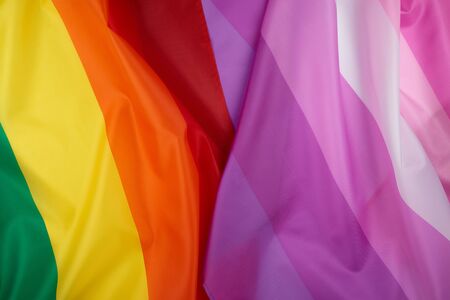 rainbow and pink flag a symbol of the LGBT community, symbol of freedom of choice of lesbians, gays, bisexuals and transgender peopleの写真素材