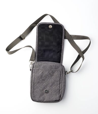 open gray textile men's bag with a long strap on a white background, top viewの写真素材
