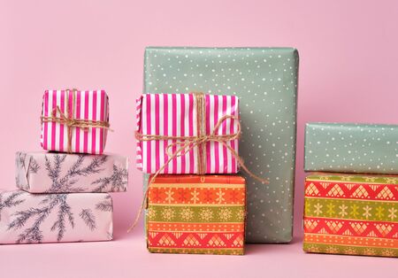 stack of colored paper wrapped gift boxes. great design for any purposes.の写真素材