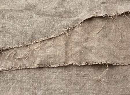 texture very old vintage gray linen fabric, full frame, rough antique canvas, close up