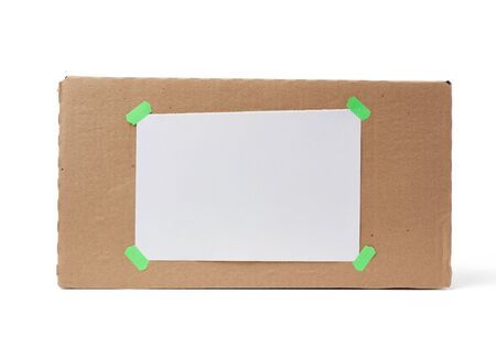 brown square cardboard box for transporting goods isolated on white background, close upの写真素材