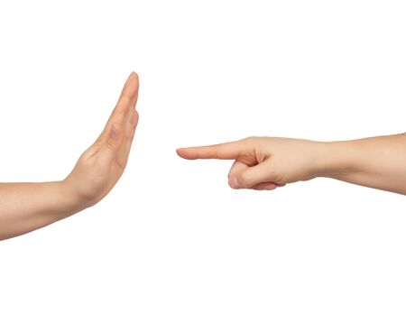 female hand holds pointing with index finger, opposite the hand shows a gesture of stop, the concept...
