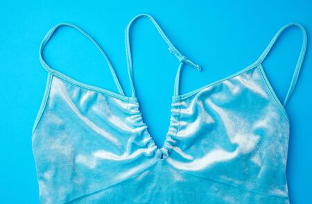 blue velour top on a blue background, female wardrobe detail, top viewの写真素材