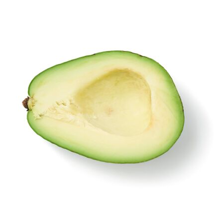 half ripe green avocado pitted isolated on white background, top view