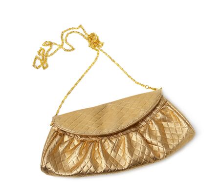 golden leather fashion clutch on a metal chain isolated on white background, top viewの写真素材