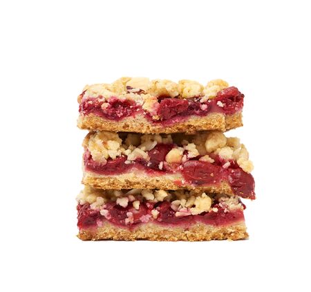stack of square baked slices of cramble with red cherry isolated on a white background, delicious pieの写真素材