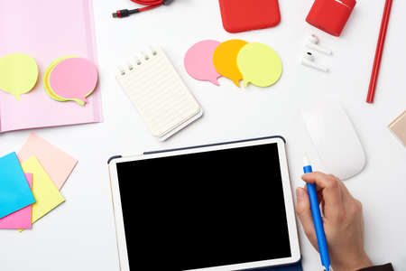 white electronic tablet and wireless mouse, the process of working or drawing on the screen,...