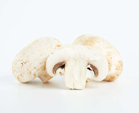 fresh cut mushrooms champignons on white background, close upの写真素材