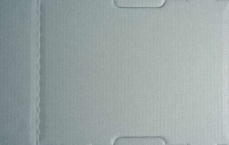 gray cardboard texture with folds, full frame, close up