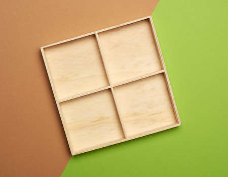 empty wooden box on green brown background, top view, flat layの写真素材