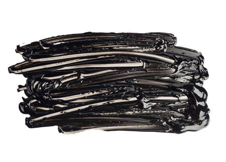 swatch of black smudged acrylic paint, smear isolated on white background, close upの写真素材