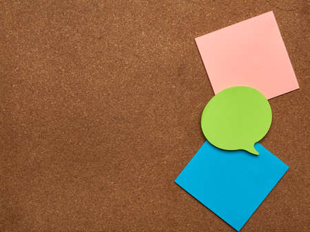 colorful paper stickers glued on brown board, idea and multitasking, close up, copy spaceの写真素材