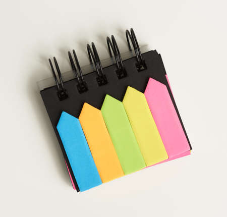 various blank paper multicolored stickers on a white background, close up