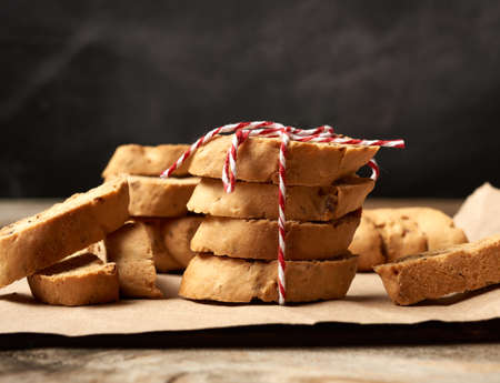 baked piece Italian almond biscotti, cantuccini cookies, traditional italian Christmas, New Year dry cookiesの写真素材