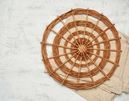 wicker round vintage dish rack on white background, top view