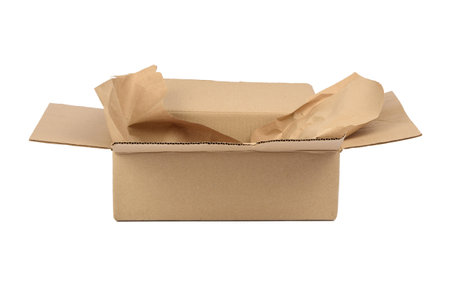 open cardboard rectangular box made of corrugated brown paper isolated on a white background, a torn...