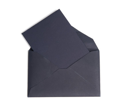 black paper envelope and blank sheet of paper inside isolated on white background, close up
