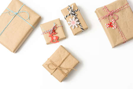 square box wrapped in brown kraft paper and tied with rope, gift on white background, top view