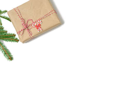 box wrapped in brown kraft paper and tied with rope, gift on white background, top view, copy spaceの写真素材