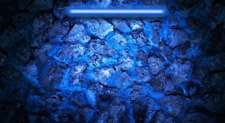 illuminated brick wall in blue neon color, abstract background, copy spaceの写真素材