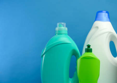 plastic bottles with detergents on blue background, copy spaceの写真素材