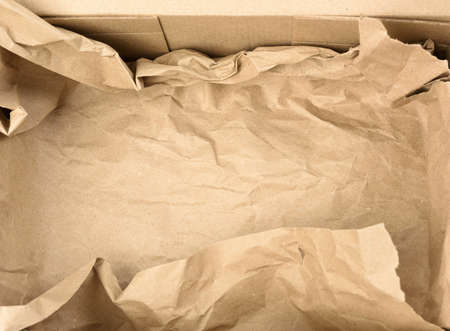 open empty rectangular brown cardboard box for transportation and packaging of goods, top view. At...