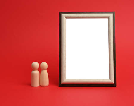 empty rectangular blank wooden frame, red background, copy spaceの写真素材
