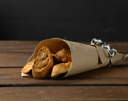 pieces of baked italian christmas biscotti cookies, wooden backgroundの写真素材